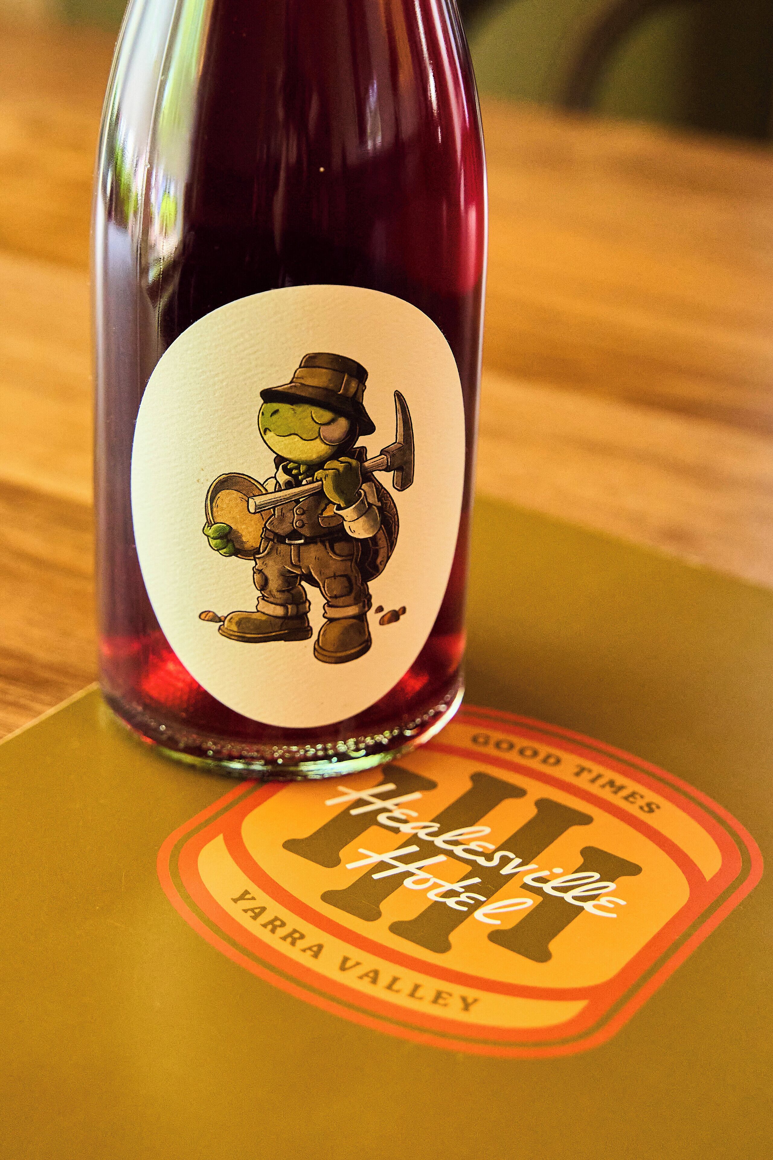 A bottle with a label featuring a cartoon character and text.