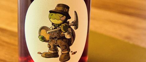 A bottle with a label featuring a cartoon character and text.