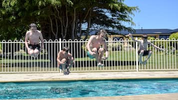 Outdoor pool, open 9:00 AM to 8:00 PM, pool loungers
