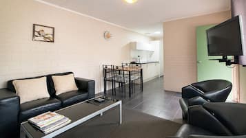 Deluxe Twin | Living area | TV, DVD player