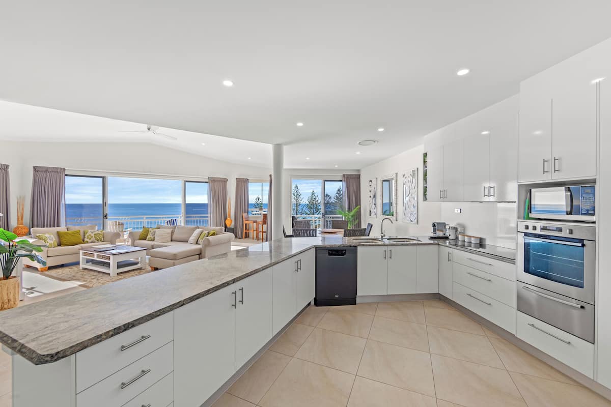 full-sized fridge, microwave, stovetop, coffee/tea maker