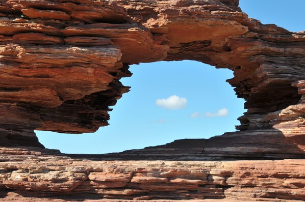 A natural rock formation with a large archway.