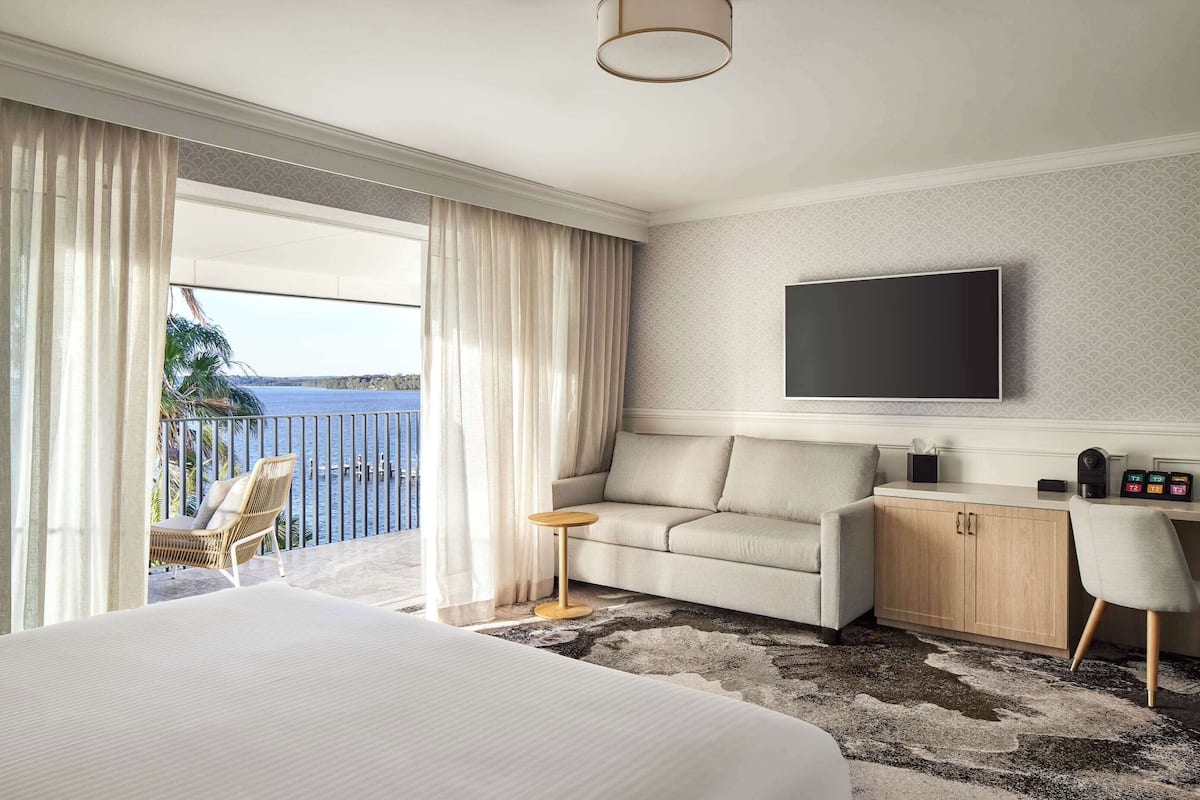 deluxe room, 1 king bed (water view) | in-room safe, individually furnished, desk, laptop workspace