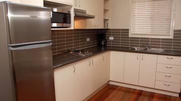 Full-sized fridge, microwave, stovetop, coffee/tea maker