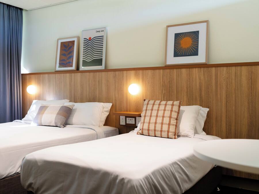 Desk, blackout drapes, iron/ironing board, bed sheets