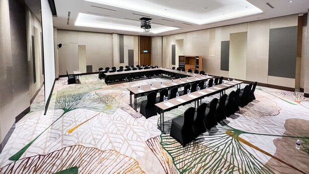 A conference room with a long table, multiple chairs, and a patterned carpet. - Villea Port Dickson (Port Dickson)