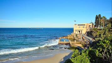 Beach nearby, white sand, beach towels