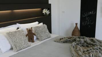 Premium bedding, down comforters, pillowtop beds, minibar