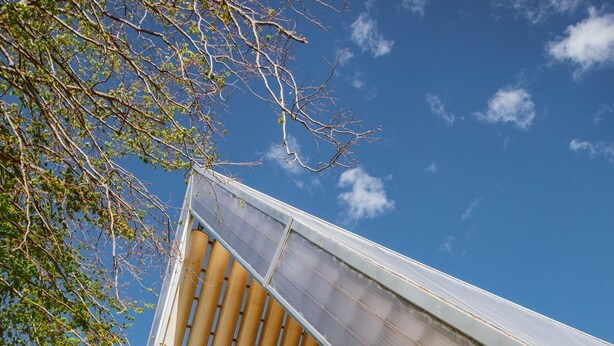 A modern building with a sloped roof and large windows. - AAA Northlands Motel (Christchurch)