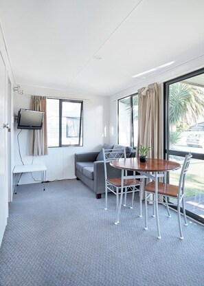 Cabin, 2 Bedrooms (Small bunks for children) | Living area - Mercury Bay Holiday Park (Whitianga)