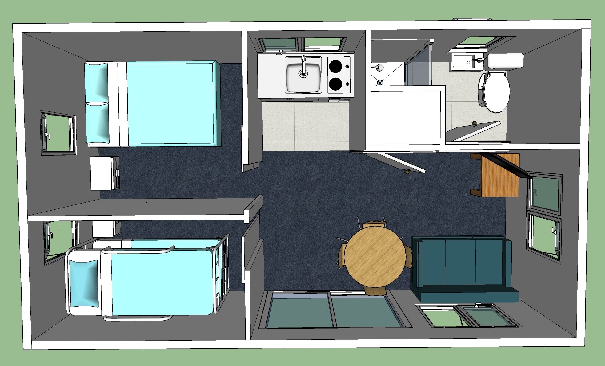 A hotel room layout with a bed, a small kitchenette, a bathroom, and a seating area with a table and chairs.