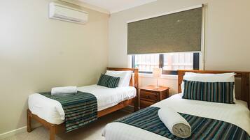 Deluxe Townhome, Multiple Bedrooms, Non Smoking, Kitchen (3 Bedroom Townhouse) | Iron/ironing board, free WiFi, bed sheets