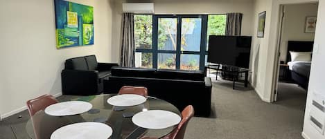 Two Bedroom | Living area | 40-inch flat-screen TV with satellite channels, TV