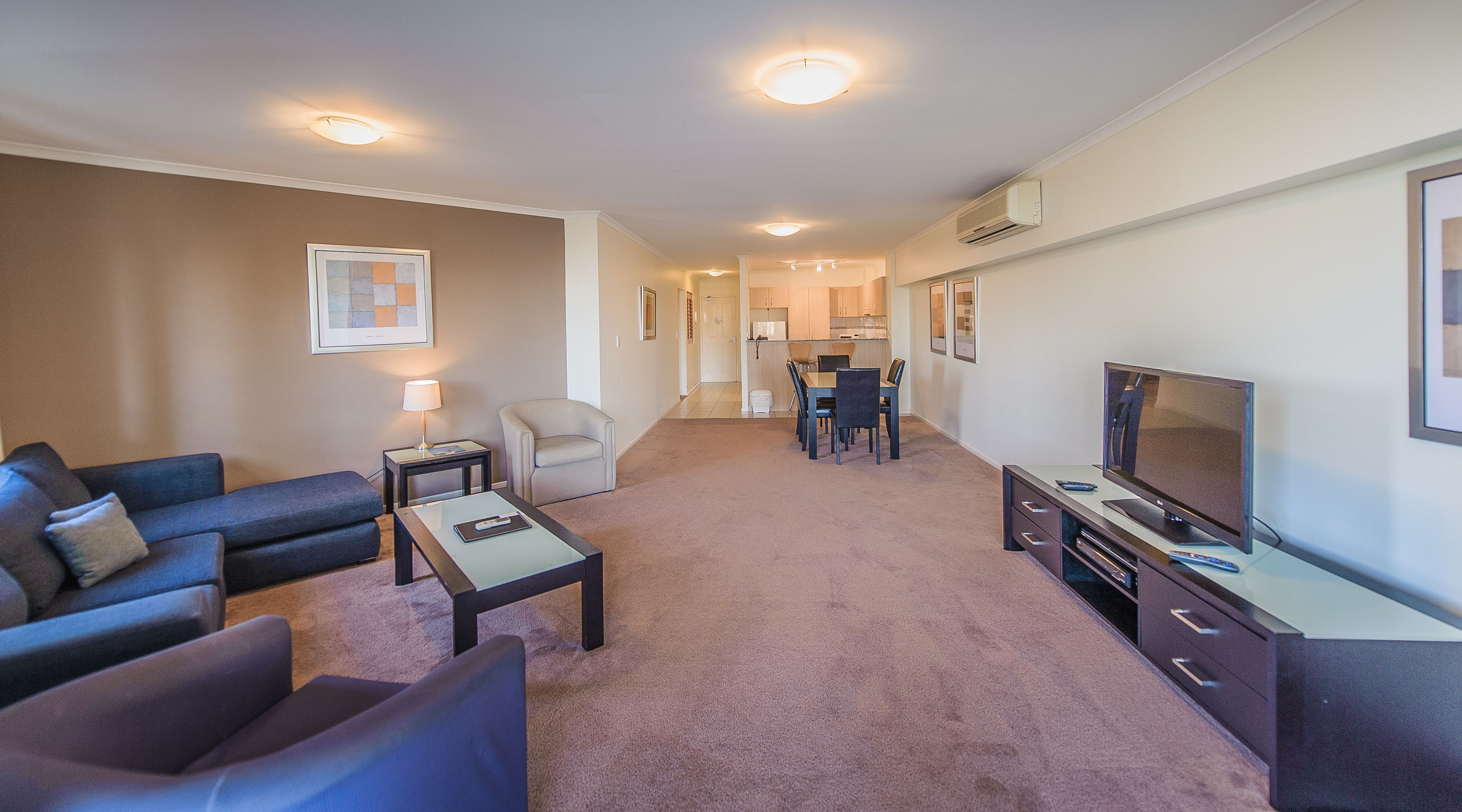 three bedroom apartment | living area | 46-inch flat-screen tv with digital channels, led tv, dvd player