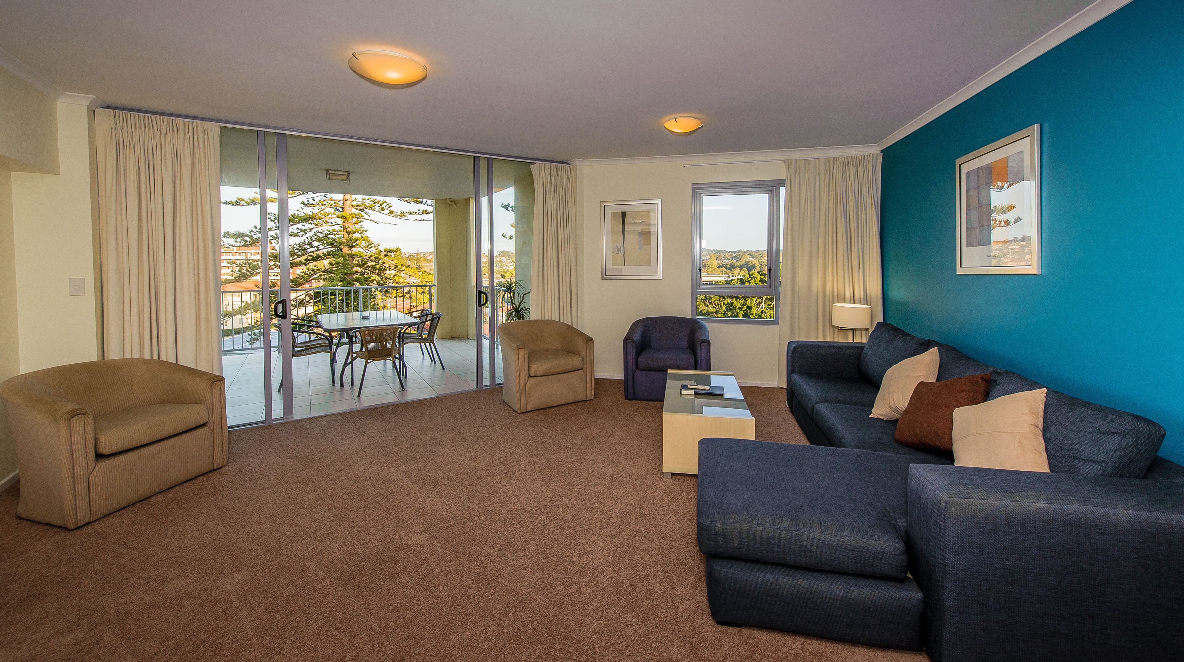 three bedroom apartment | living area | 46-inch flat-screen tv with digital channels, led tv, dvd player