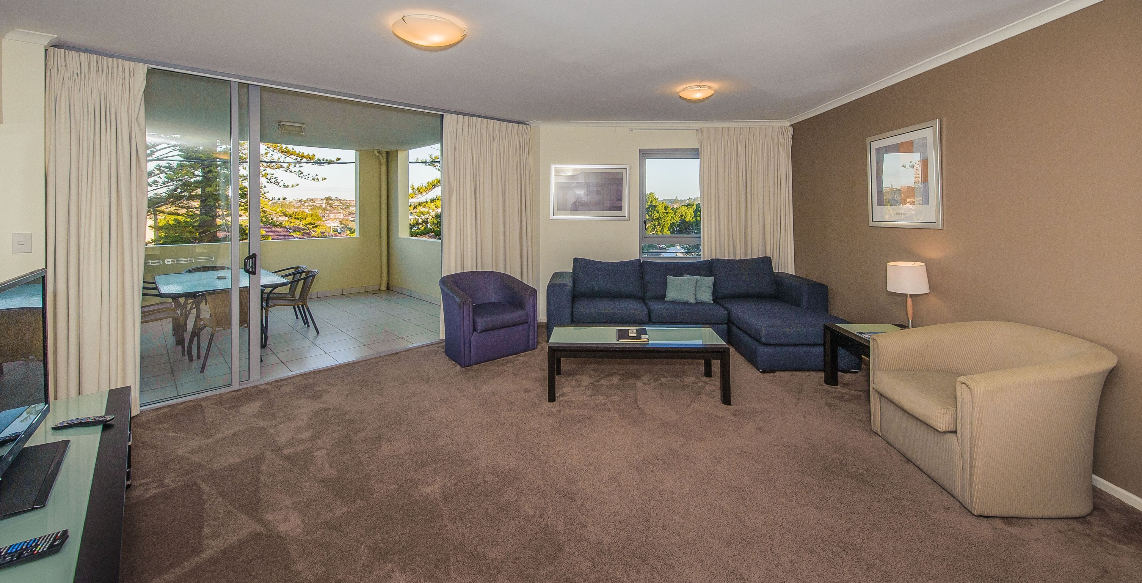 three bedroom apartment | living area | 46-inch flat-screen tv with digital channels, led tv, dvd player