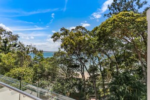 A balcony with a clear view of a beach and ocean. - Little Cove Court (Noosa Heads)