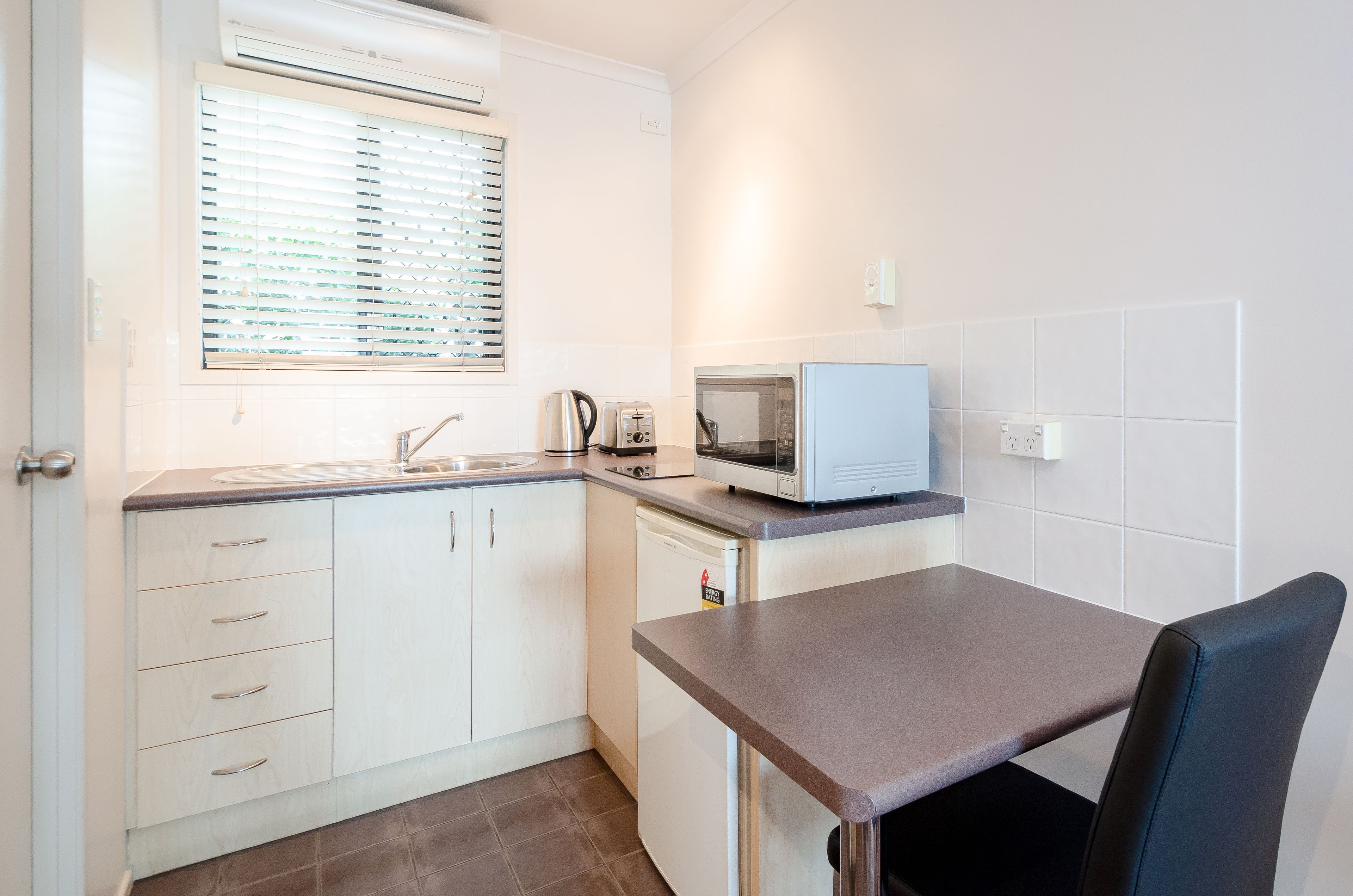 Fridge, microwave, stovetop, coffee/tea maker