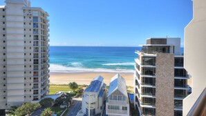 A high-rise building with multiple balconies overlooking a beach. - Bougainvillea Luxury Apartments (Main Beach)