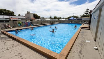 Seasonal outdoor pool, pool loungers