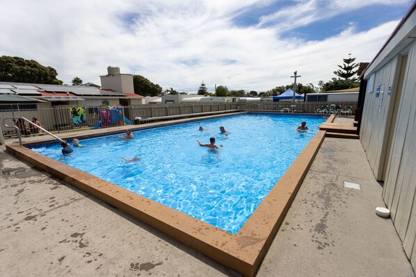 Seasonal outdoor pool, pool loungers