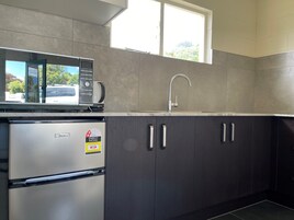 Standard Suite, 1 Bedroom, Non Smoking, Kitchenette | Desk, soundproofing, iron/ironing board, bed sheets