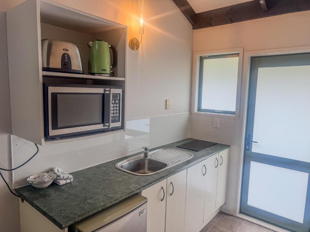 Microwave, stovetop, coffee/tea maker, electric kettle