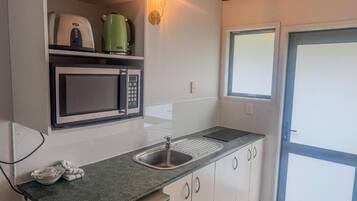 Microwave, stovetop, coffee/tea maker, electric kettle