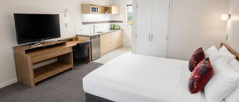 Premium bedding, desk, blackout drapes, iron/ironing board