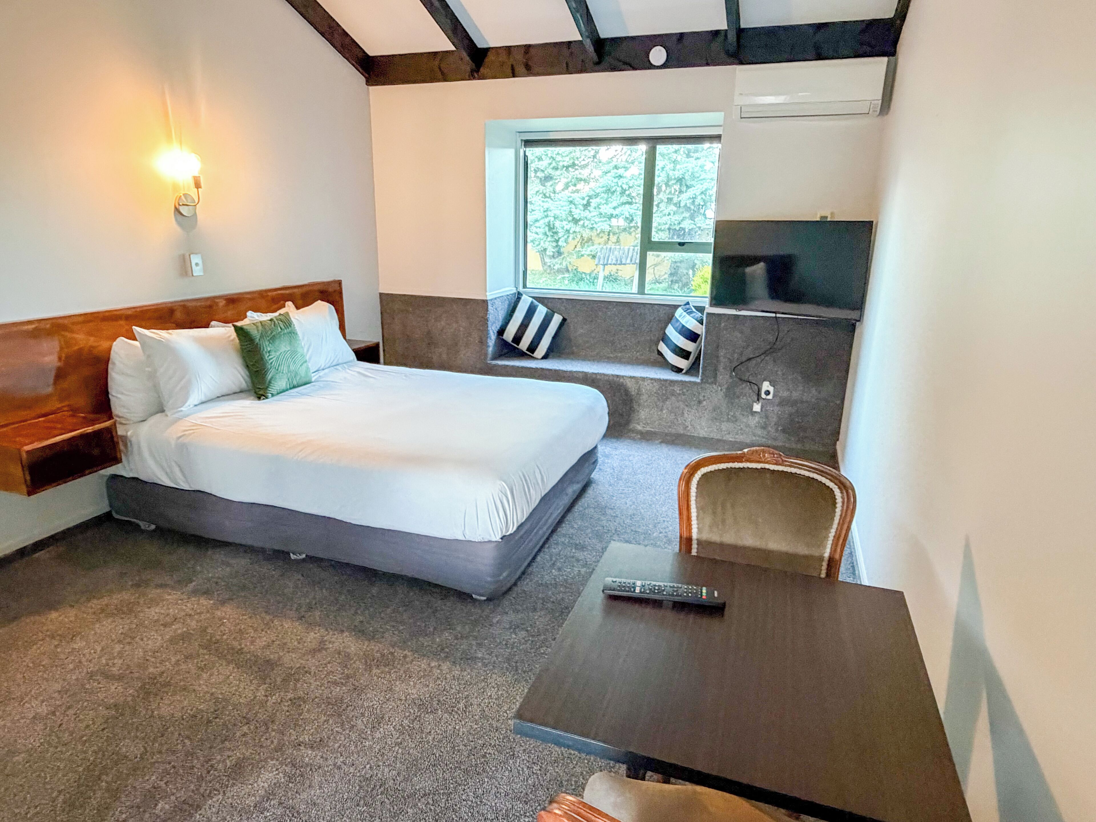 Standard Studio | Premium bedding, desk, blackout drapes, iron/ironing board