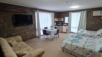 Family Twin Room, 2 Double Beds (First floor) | Laptop workspace, blackout drapes, iron/ironing board, bed sheets