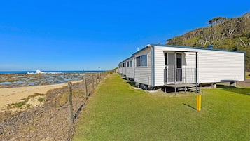 Laptop workspace, bed sheets