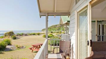 2 Bedroom Beachfront Cabin | Laptop workspace, bed sheets