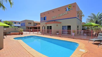 Outdoor pool, open 7:00 AM to 7:00 PM, pool loungers