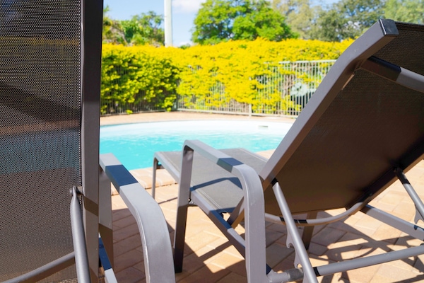 Outdoor pool, open 7:00 AM to 9:00 PM, pool umbrellas, sun loungers