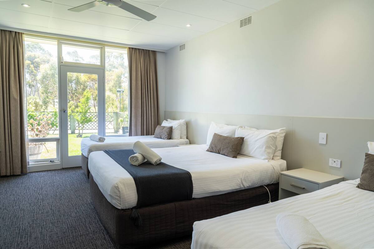 Executive Family Room | Desk, iron/ironing board, bed sheets