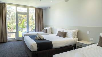 Executive Family Room | Desk, iron/ironing board, bed sheets