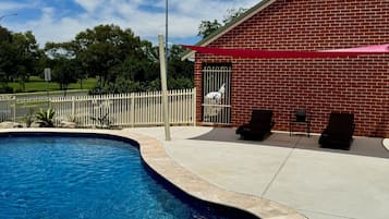 Outdoor pool, open 8:30 AM to 8:30 PM, pool loungers