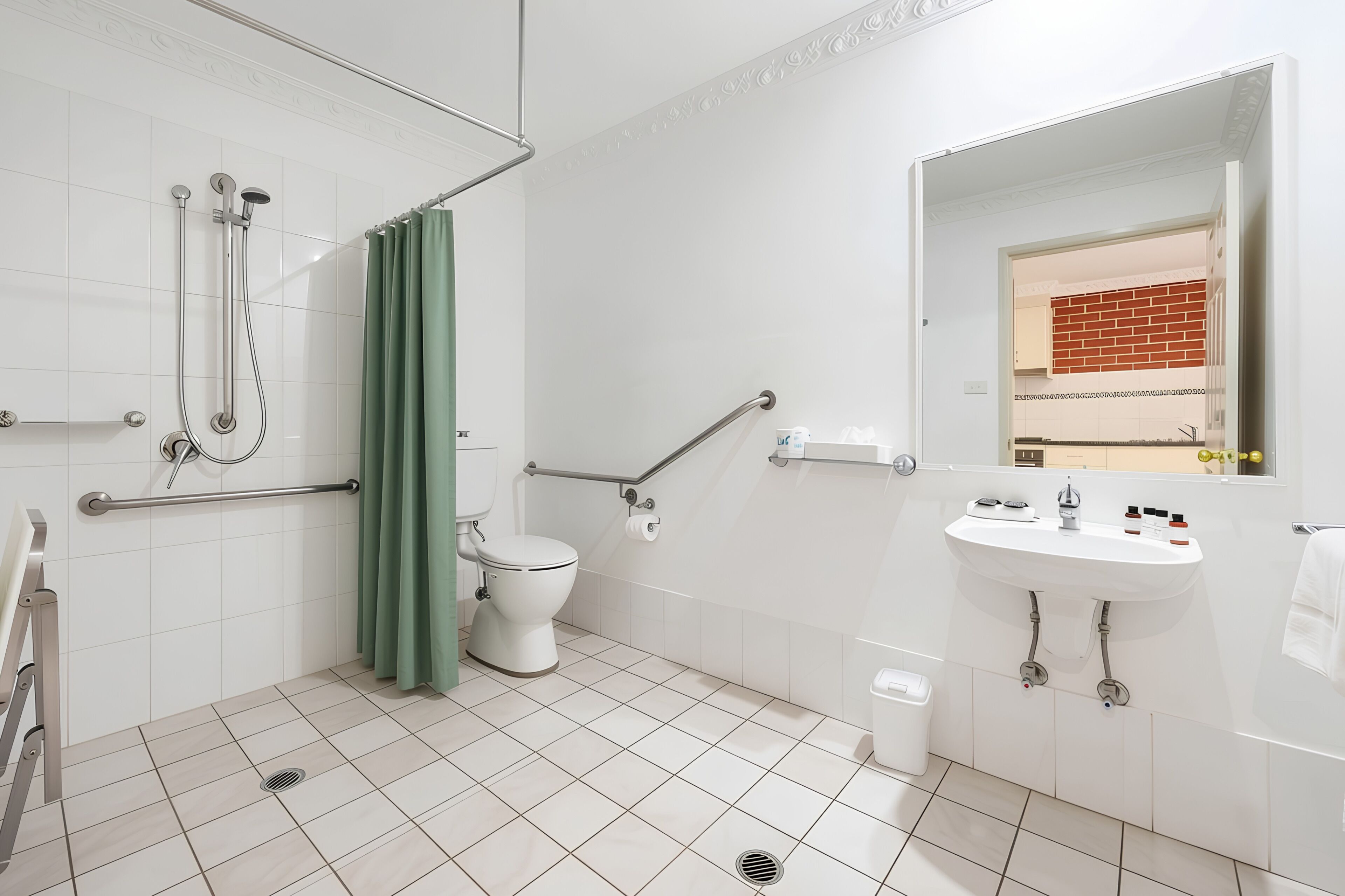 A bathroom with a shower, toilet, grab bars, and a sink.