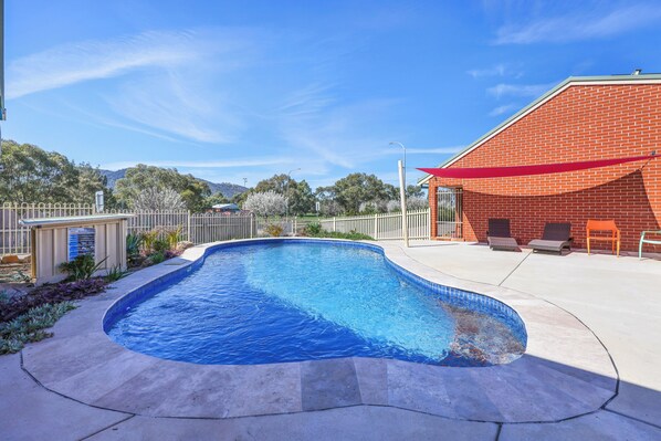 Outdoor pool, open 8:30 AM to 8:30 PM, pool loungers