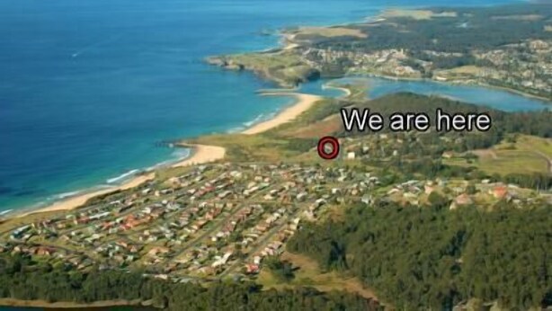 An aerial view of a coastal town with a marked location. - Beachfront Apartments Narooma (North Narooma)
