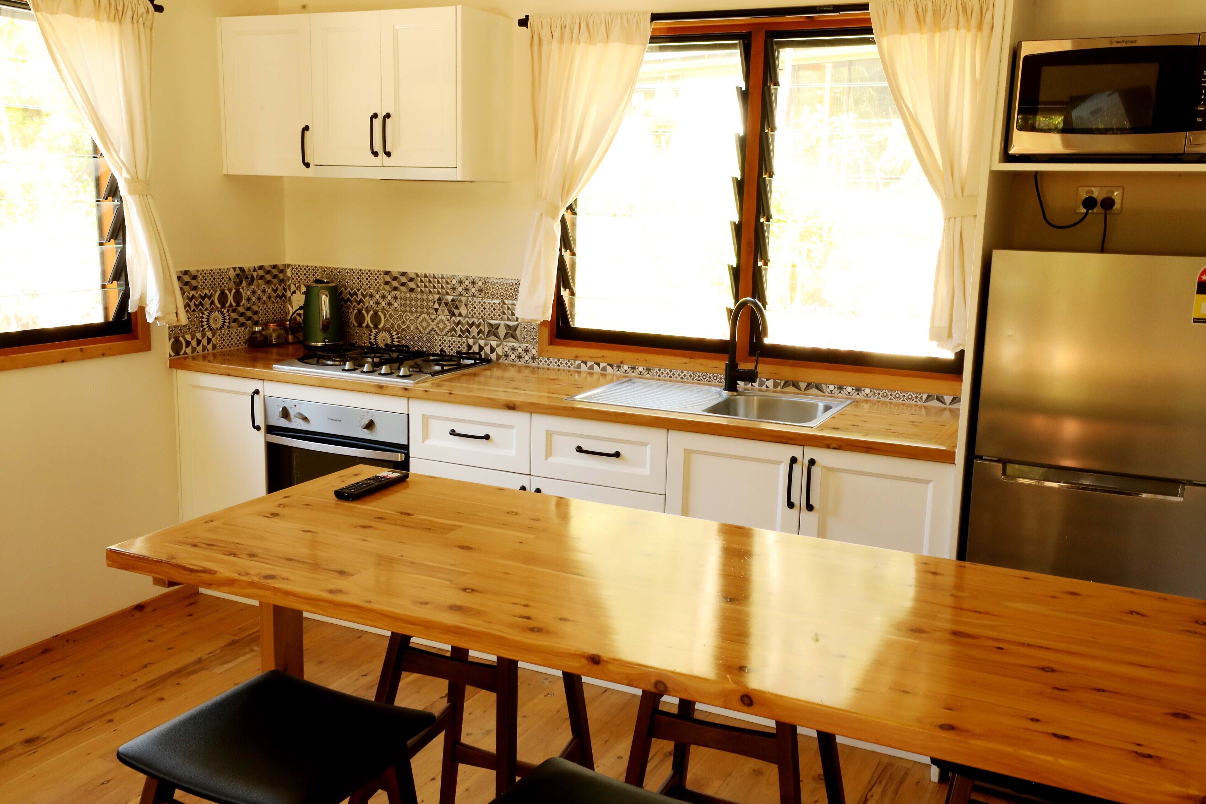 Signature Cabin | Private kitchen | Fridge, microwave, oven, stovetop