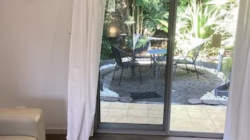 A room with a sliding glass door leading to an outdoor patio area.
