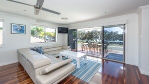 Deluxe Beach House | Living room - NRMA Woodgate Beach Holiday Park (Woodgate)