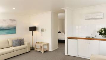 Executive Spa Suite | Living room | Flat-screen TV