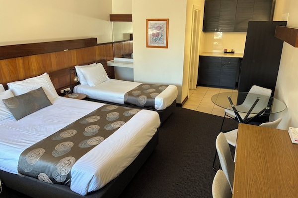 Desk, laptop workspace, blackout curtains, iron/ironing board