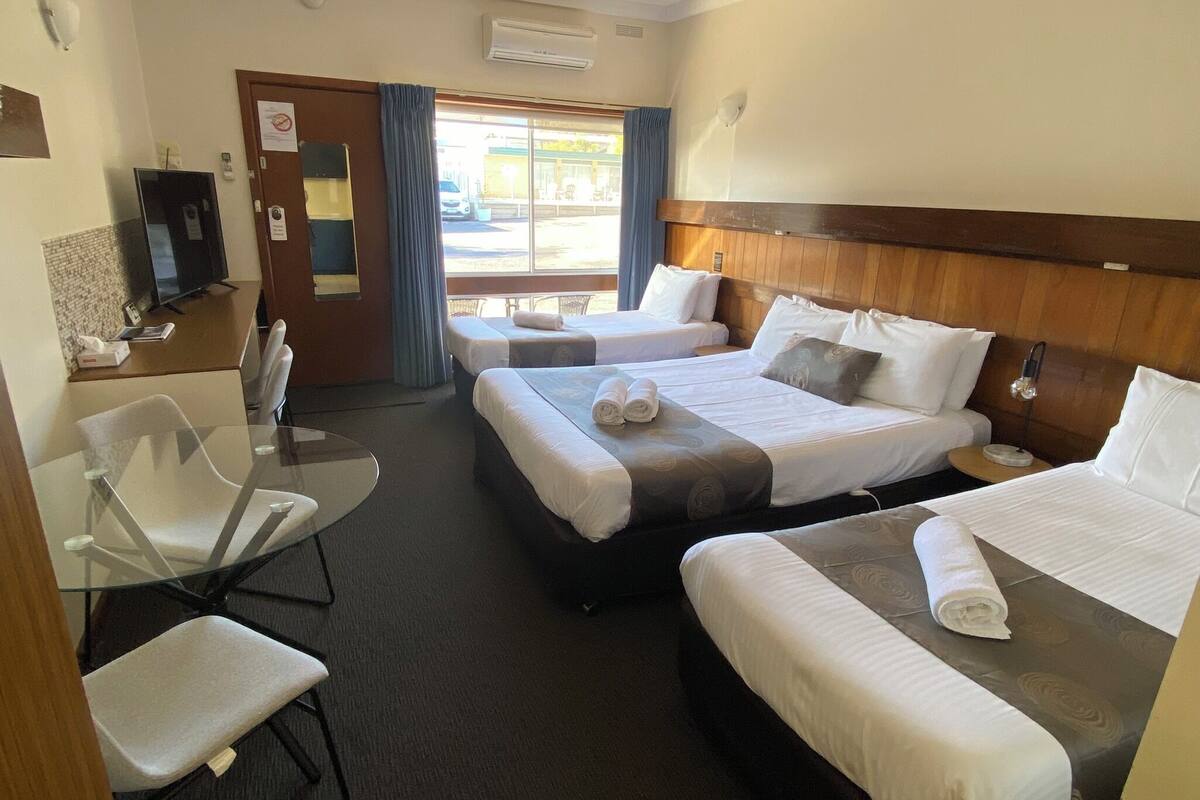 Standard Quadruple Room | 1 bedroom, desk, laptop workspace, blackout drapes