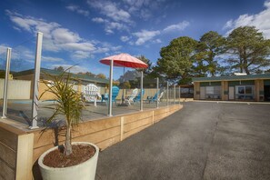 Outdoor pool, open 8 AM to 8:00 PM, pool loungers