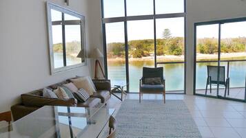 3 Bedroom Apartment - Waterfront | Living area | 32-inch flat-screen TV with digital channels, plasma TV, DVD player