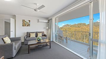 Standard Apartment, 1 Bedroom (Town Special) | Living area | 55-inch Smart TV with cable channels, TV, Netflix
